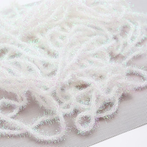 Close-up of white iridescent plush ribbon with metallic tinsel for DIY gift wrapping