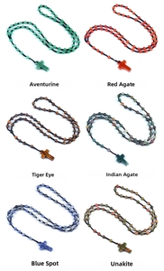 Detailed macro view of six distinct 6mm natural stone rosary cross pendants in 2x3 grid