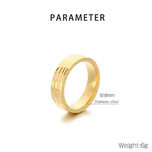 Detail view of a 6mm wide gold stainless steel ring with a hammered texture surface