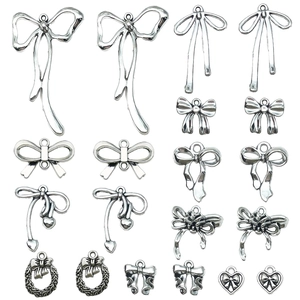 Silver hollow bow alloy pendants in various designs for DIY jewelry making