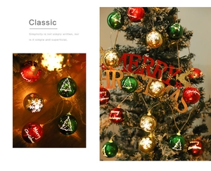 Detail of Christmas globe string lights with snowflakes and Merry Christmas lettering