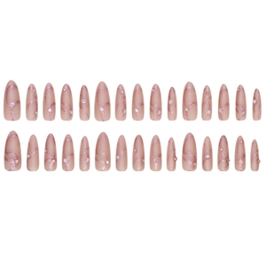 Medium almond press-on nails with nude pink base, glitter waves, and rhinestone accents