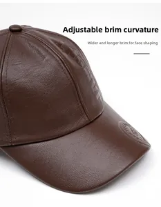 Close-up of a brown faux leather baseball cap showing a foldable wide brim design