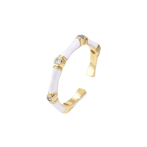Elegant gold-plated open ring with white enamel bamboo design and sparkling zircons