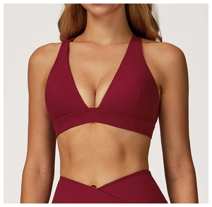 Detail of burgundy yoga bra with deep V-neck and supportive wide shoulder straps