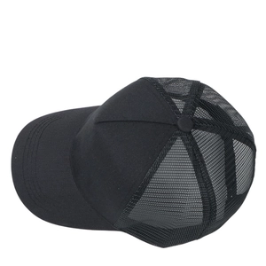 Detailed close-up of the breathable mesh texture on this black adjustable trucker hat