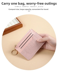 Pink faux crocodile leather card holder with multiple slots and metal keychain zipper