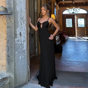 Close-up of sexy backless maxi dress featuring silk patchwork and front cutout detail
