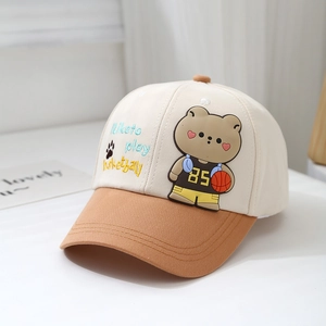 Close-up of baby baseball cap with bear mascot and I like to play basketball embroidery