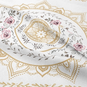 Close-up of bohemian mandala tapestry featuring pink roses and golden patterns on cotton fabric