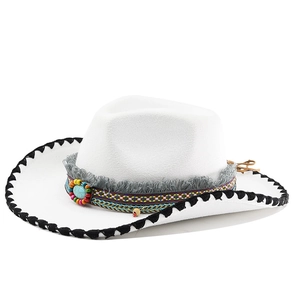 Detail of white felt cowboy hat with turquoise beadwork and fringe decoration