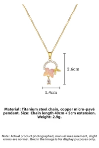 Macro detail of butterfly pendant with pink stones and pearl on titanium steel chain