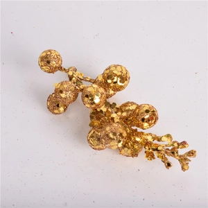 Detail of golden glitter artificial berry stem for DIY Christmas tree wreath decoration