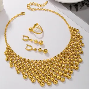 Golden multi-layer beaded choker necklace set with matching earrings and ring