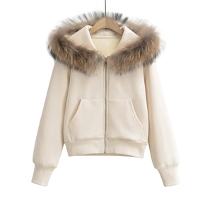 Detailed view of women's cream hoodie featuring a plush detachable faux fur hood trim