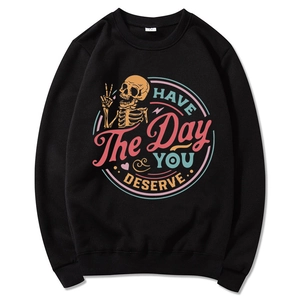 Black crewneck sweatshirt with retro skeleton print and HAVE THE DAY YOU DESERVE text