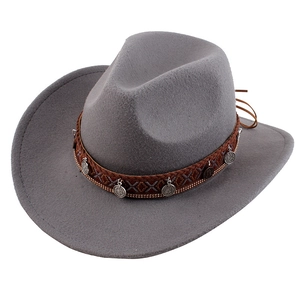 Detail of grey felt cowboy hat with ethnic braided band and silver metal pendants