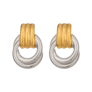 Detail of minimalist two-tone geometric hoop earrings in polished gold and silver finish