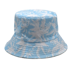 Detail of light blue sun hat with tropical palm tree print and reinforced stitching