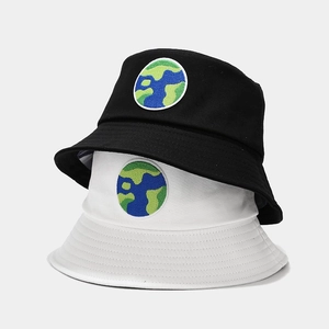 Black and white canvas bucket hats with globe embroidery for sun protection and outdoor style