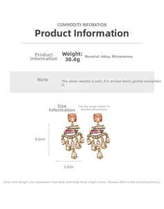 Detail view of vintage earrings showing dimensions of 6.6cm by 3.2cm and rhinestone accents