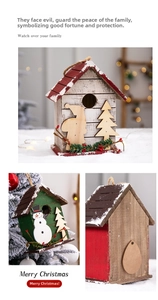 Detailed view of rustic wooden Christmas birdhouse ornaments with snowy holiday accents