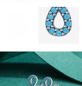 Macro shot of 925 sterling silver turquoise stud earrings with S925 hallmark detail