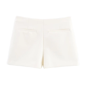 Detailed close-up of high-waist white skort with back decorative pockets and stitching