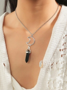 Detail of silver crescent moon necklace with black hexagonal crystal pendant on model