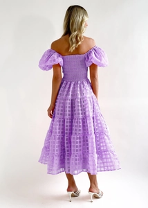 Detail of smocked back and tiered skirt on purple gingham off-shoulder dress