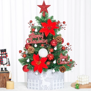 Mini Christmas tree with red flowers and star on top in a grey felt reindeer pot