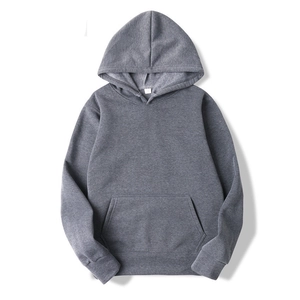 Detail of dark grey drawstring hoodie showing kangaroo pocket and ribbed cuffs
