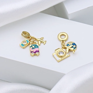 Travel-themed gold-plated beads with Eiffel Tower, camera, and airplane enamel charms