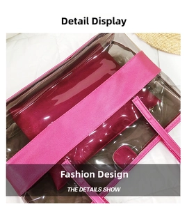 Macro view of clear PVC beach bag with rose red leather trim and inner pouch detail