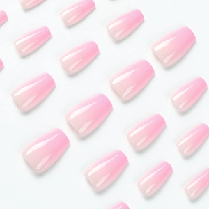 Short ballet-style pink gradient press-on nails set with glossy finish on white background