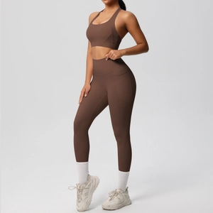 Detail view of dark brown high waist yoga leggings with side pockets and sports bra set