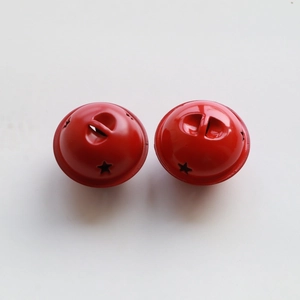 Detailed view of two red 4cm metal star-cutout bells with loop for DIY Christmas decor