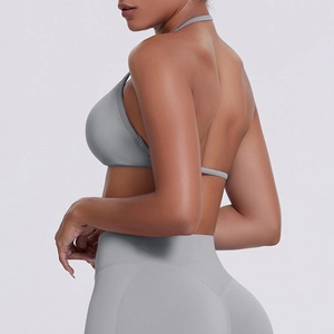 Detail of gray ribbed seamless yoga set showing racerback halter top and high-waist leggings