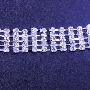 Macro shot of silver five-row rhinestone chain with sparkling clear crystal detail