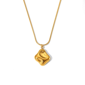 Detailed macro view of 18K gold snake chain necklace with fluid geometric pendant