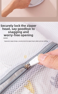 Detail showing the gray zipper and protective cover on coarse mesh laundry bag