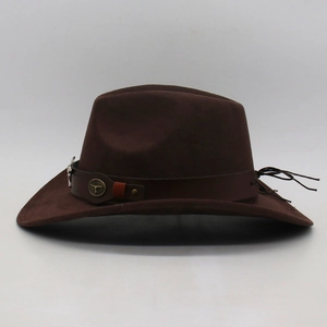 Detail view of a dark brown felt cowboy hat featuring a vintage metal bull head accent