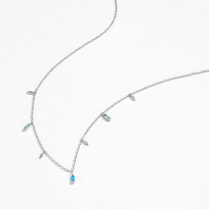 Detail of S925 silver necklace featuring light blue marquise stones and metal leaves