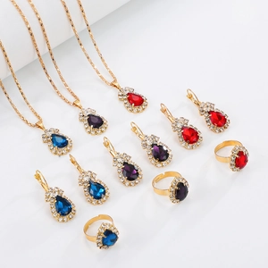 Detail of colorful water drop jewelry set with necklaces, earrings and rings on white background