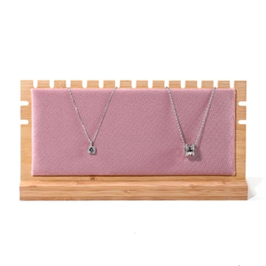 Pink velvet and natural solid wood necklace display stand with multiple hanging hooks