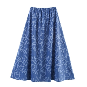 Detailed view of blue A-line midi skirt featuring leaf jacquard texture and elastic waistband