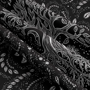 Close-up of bohemian tree of life tapestry showing fine white lines on black fabric