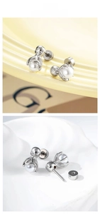 Detailed view of silver octopus pearl stud earring with sparkling cubic zirconia accents