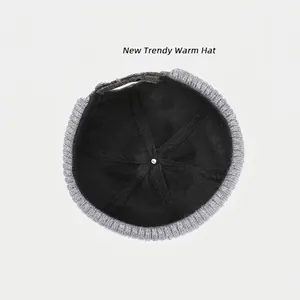 Internal structure of grey distressed knit beanie with reinforced black lining and hex webbing