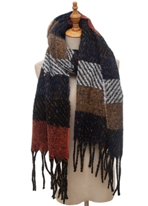 Detailed view of the colorful striped knit scarf with fringes on a wooden mannequin